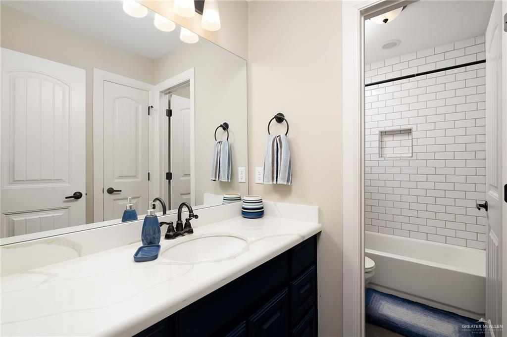 6323 Cascada Bnd Road McAllen, TX 78504 - Photo 20 of 26 a bathroom with a sink and a mirror