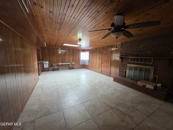 a view of a hall with wooden floor