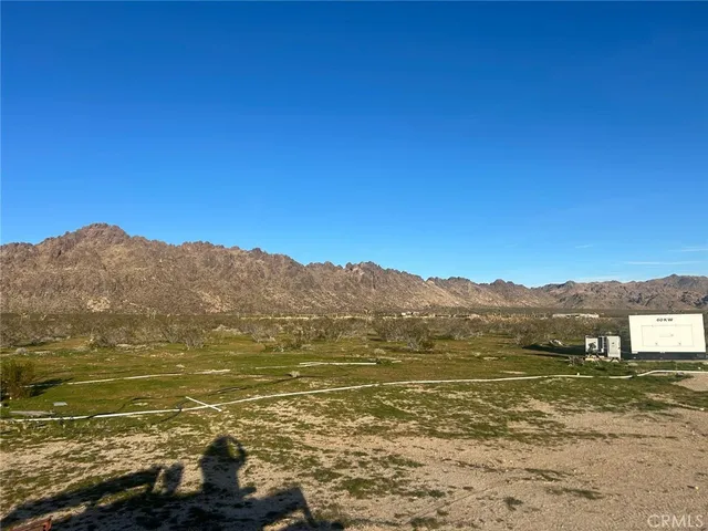 a view of lake with mountain