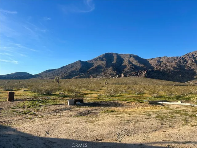 a view of ocean with mountains