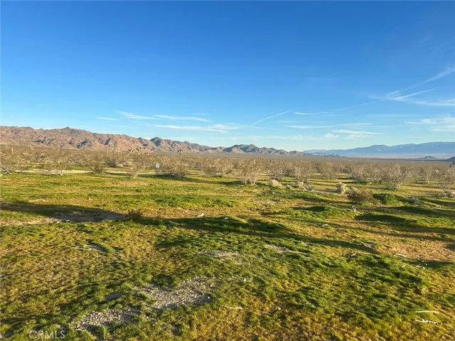 a view of an ocean from a mountain