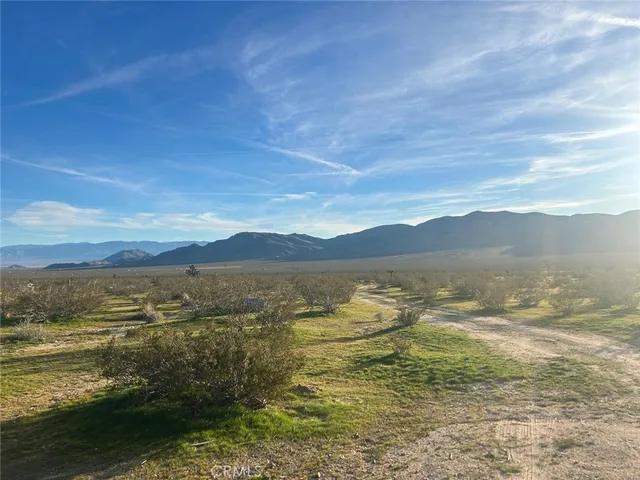 a view of an ocean with a mountain