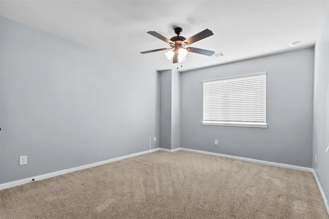 a view of a room with a fan