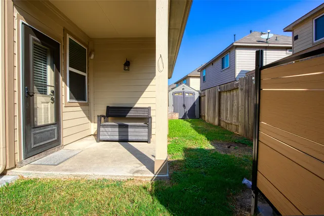a view of a house with backyard and deck