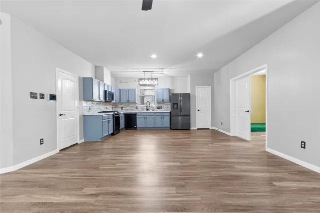 a view of kitchen with wooden floor