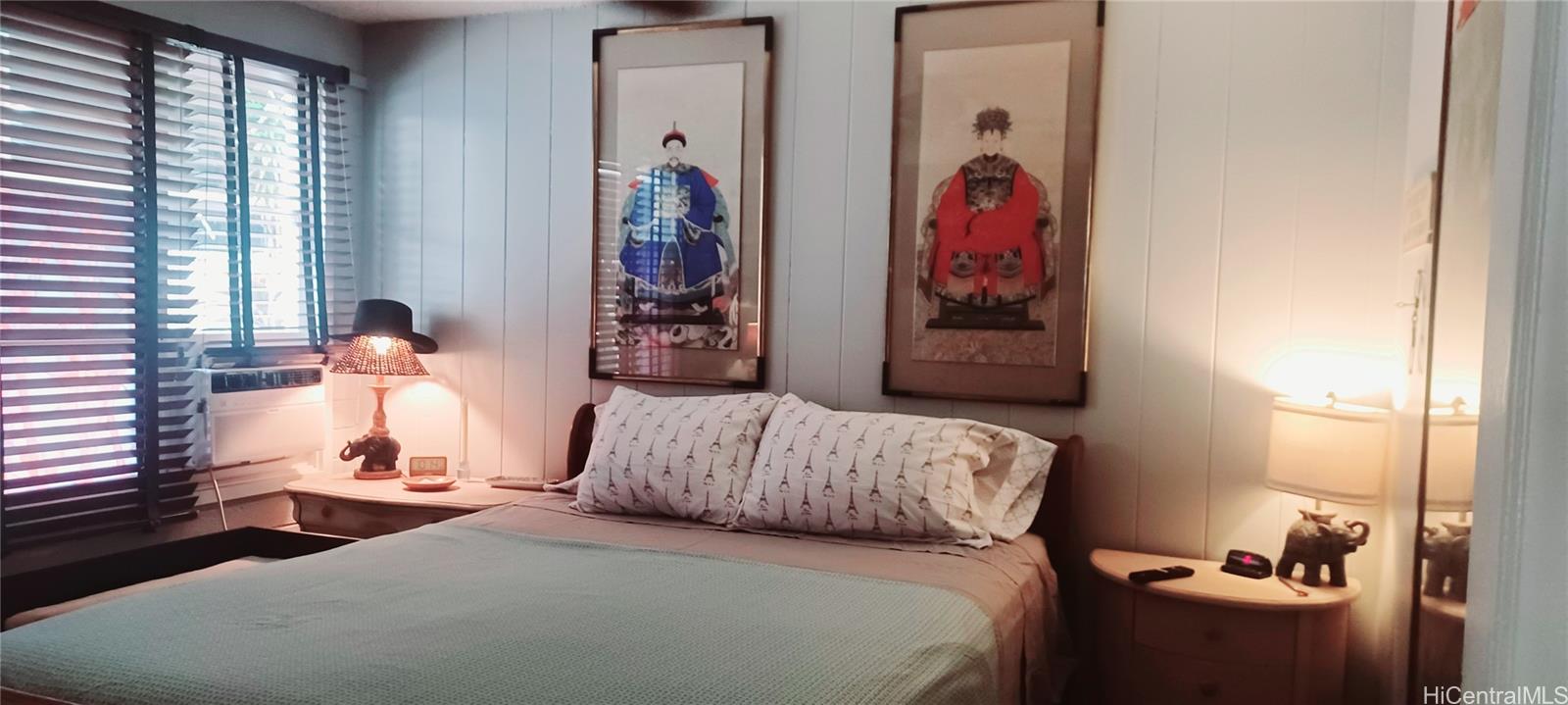 423 Kaiolu Street, Unit 106 Honolulu, HI 96815 - Photo 13 of 25 a bedroom with a bed and a window