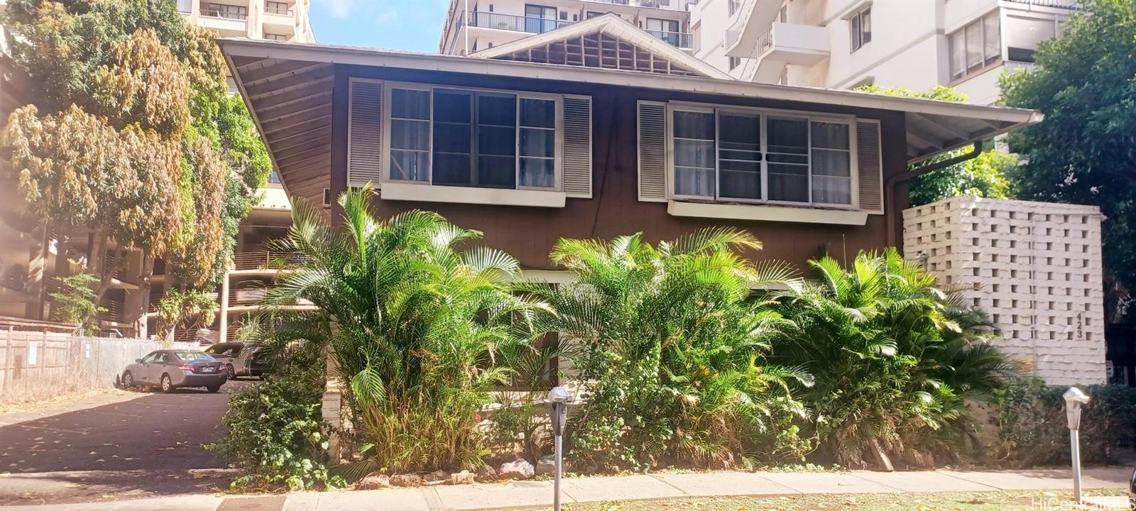423 Kaiolu Street, Unit 106 Honolulu, HI 96815 - Photo 2 of 25 a view of a house with a large window and plants