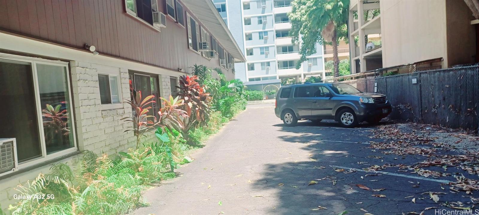 423 Kaiolu Street, Unit 106 Honolulu, HI 96815 - Photo 21 of 25 a front view of a house with a yard