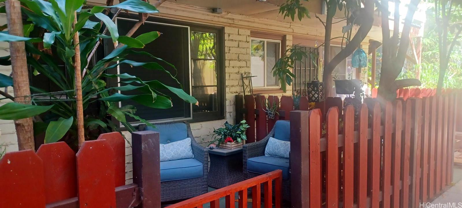 423 Kaiolu Street, Unit 106 Honolulu, HI 96815 - Photo 5 of 25 a view of a balcony with chairs and a potted plant