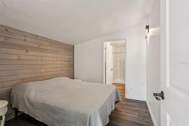 a bedroom with a bed and a shower