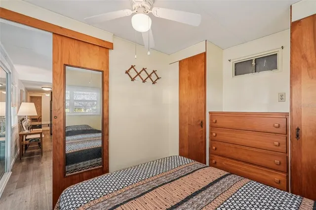 a bedroom with a bed and a dresser