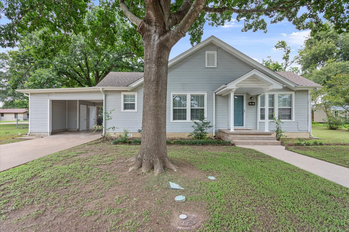 1607 North Harding Avenue Cameron, TX 76520 - Photo 1 of 37 A charming single-story residence with a welcoming front porch and convenient carport.