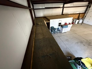588 North 4500 West West Point, UT 84015 - Photo 46 of 61 Industrial space featuring an expansive concrete floor, visible metal beam construction, and a mezzanine level