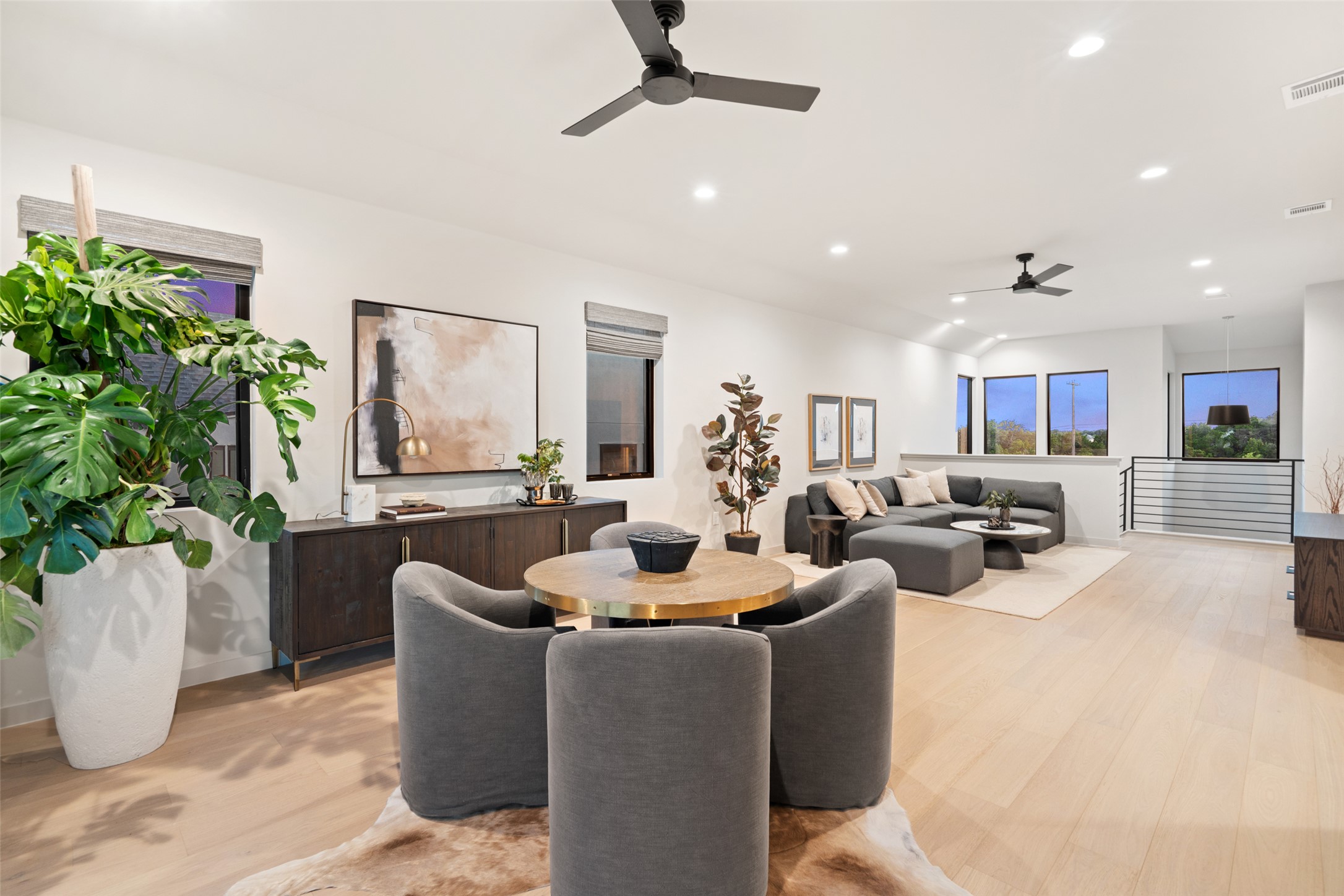 9803 Ribelin Ranch Court, Unit 6 Austin, TX 78750 - Photo 19 of 31 Blonde hardwood floors flow through this luminous open-concept living space, featuring recessed lighting and ample windows.