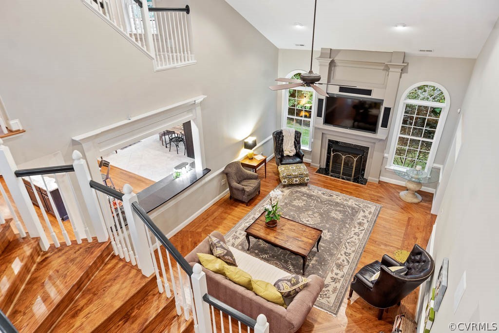 14837 Felbridge Way Midlothian, VA 23113 - Photo 23 of 50 a living room with furniture a flat screen tv and kitchen view