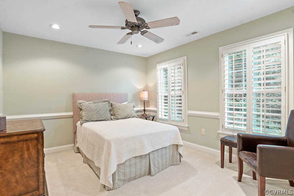 14837 Felbridge Way Midlothian, VA 23113 - Photo 27 of 50 a bedroom with a large bed and a chandelier