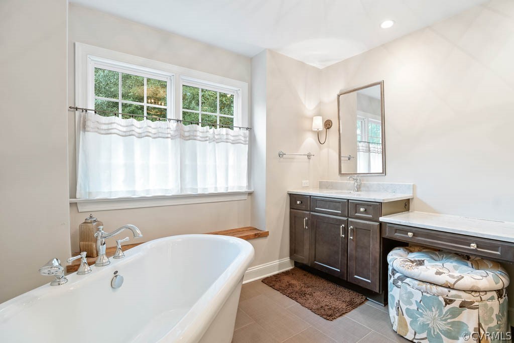 14837 Felbridge Way Midlothian, VA 23113 - Photo 35 of 50 a spacious bathroom with a tub sink and mirror