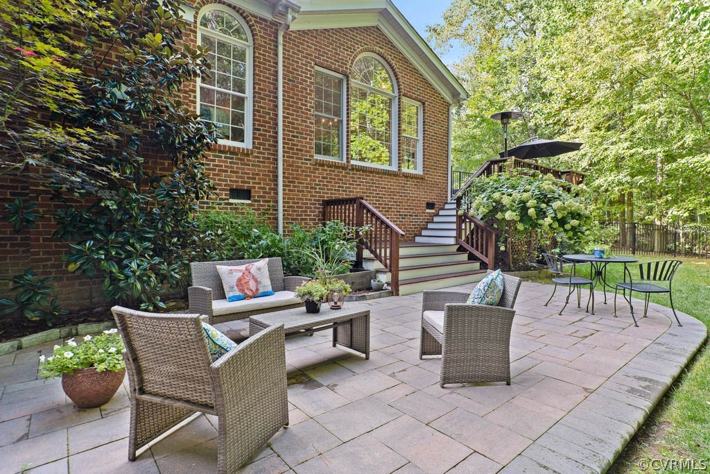 14837 Felbridge Way Midlothian, VA 23113 - Photo 38 of 50 a view of a patio with a chairs and table in a patio