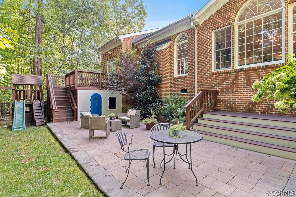 14837 Felbridge Way Midlothian, VA 23113 - Photo 39 of 50 a view of a house with backyard sitting area and furniture