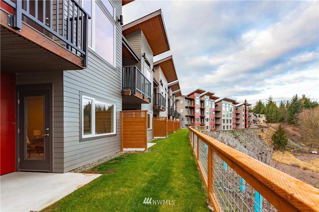 1882 Front Street, Unit 404 Lynden, WA 98264 - Photo 14 of 18 a view of building with yard