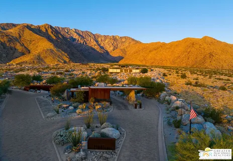 a view of a terrace with couches and wooden floor