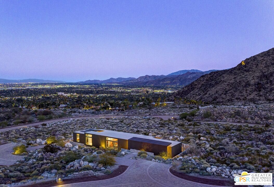 2373 Rising Sun Court Palm Springs, CA 92262 - Photo 10 of 13 a view of a backyard with wooden fence and a mountain view
