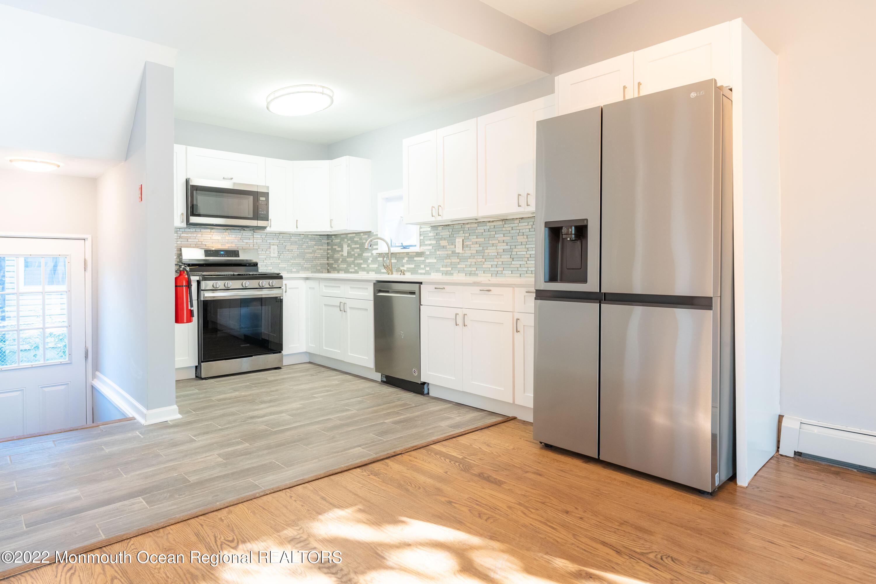 397 E Road Belford, NJ 07718 - Photo 11 of 34 a kitchen with stainless steel appliances granite countertop a refrigerator stove and oven