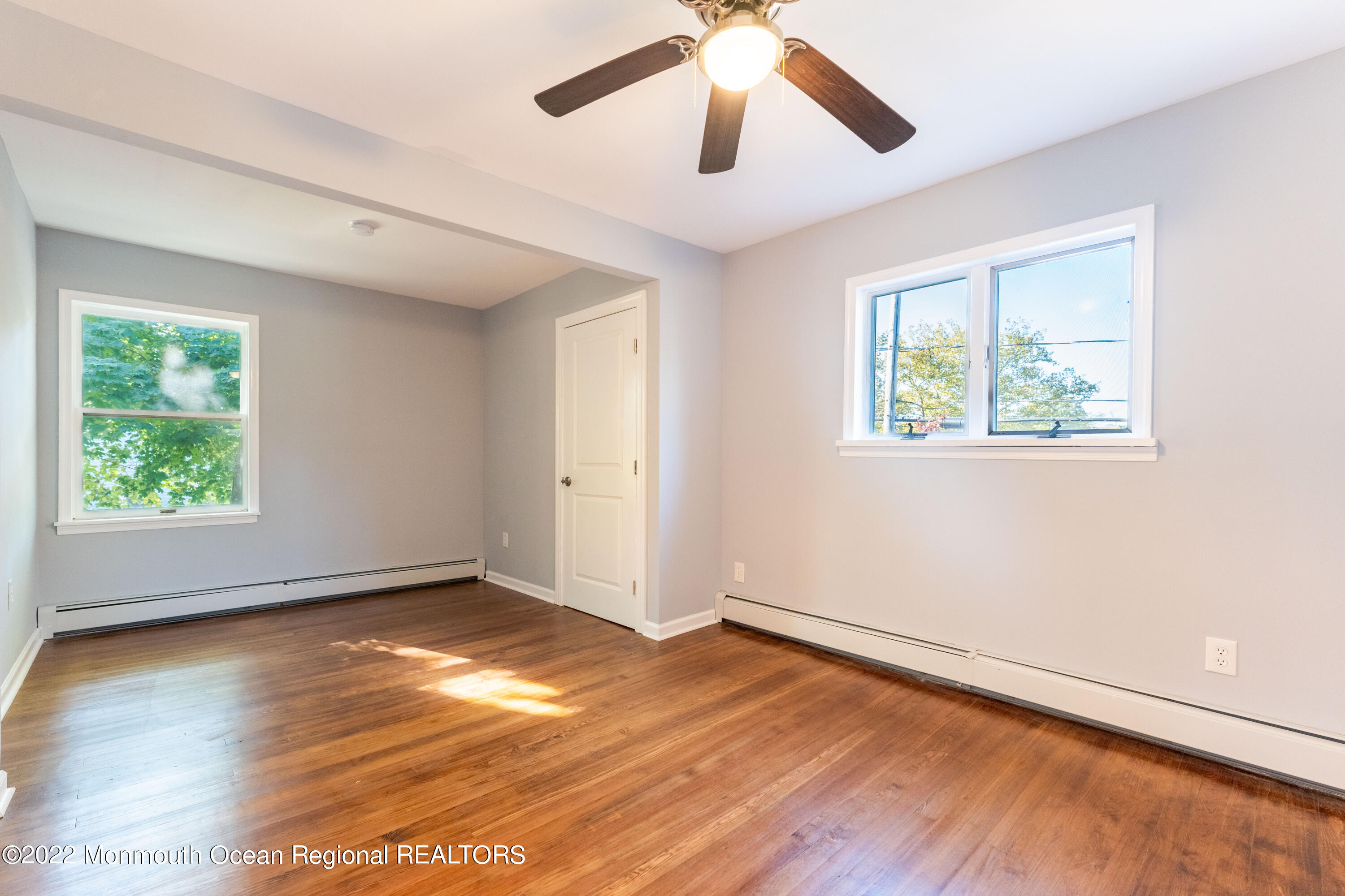 397 E Road Belford, NJ 07718 - Photo 20 of 34 a view of empty room with wooden floor and fan