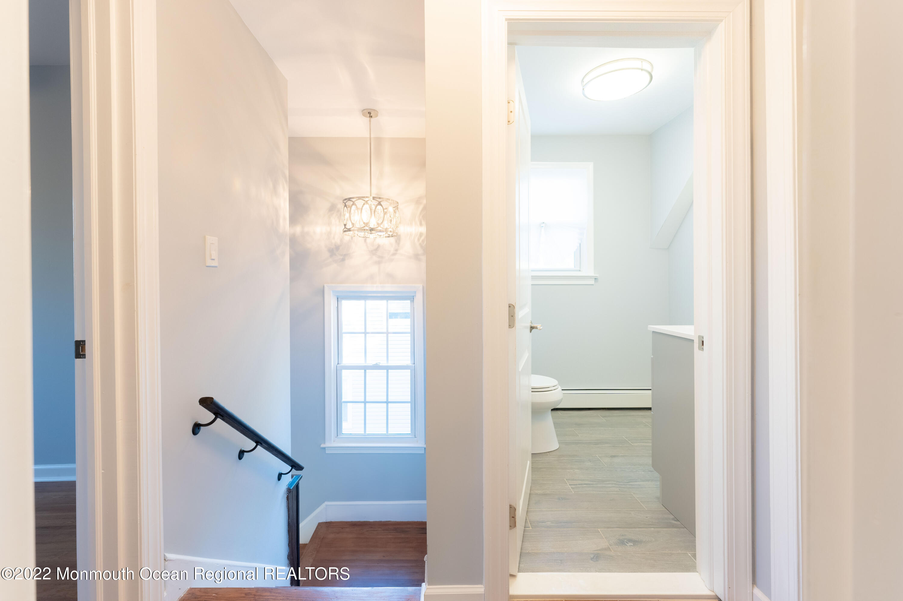 397 E Road Belford, NJ 07718 - Photo 25 of 34 a bathroom with a glass shower door