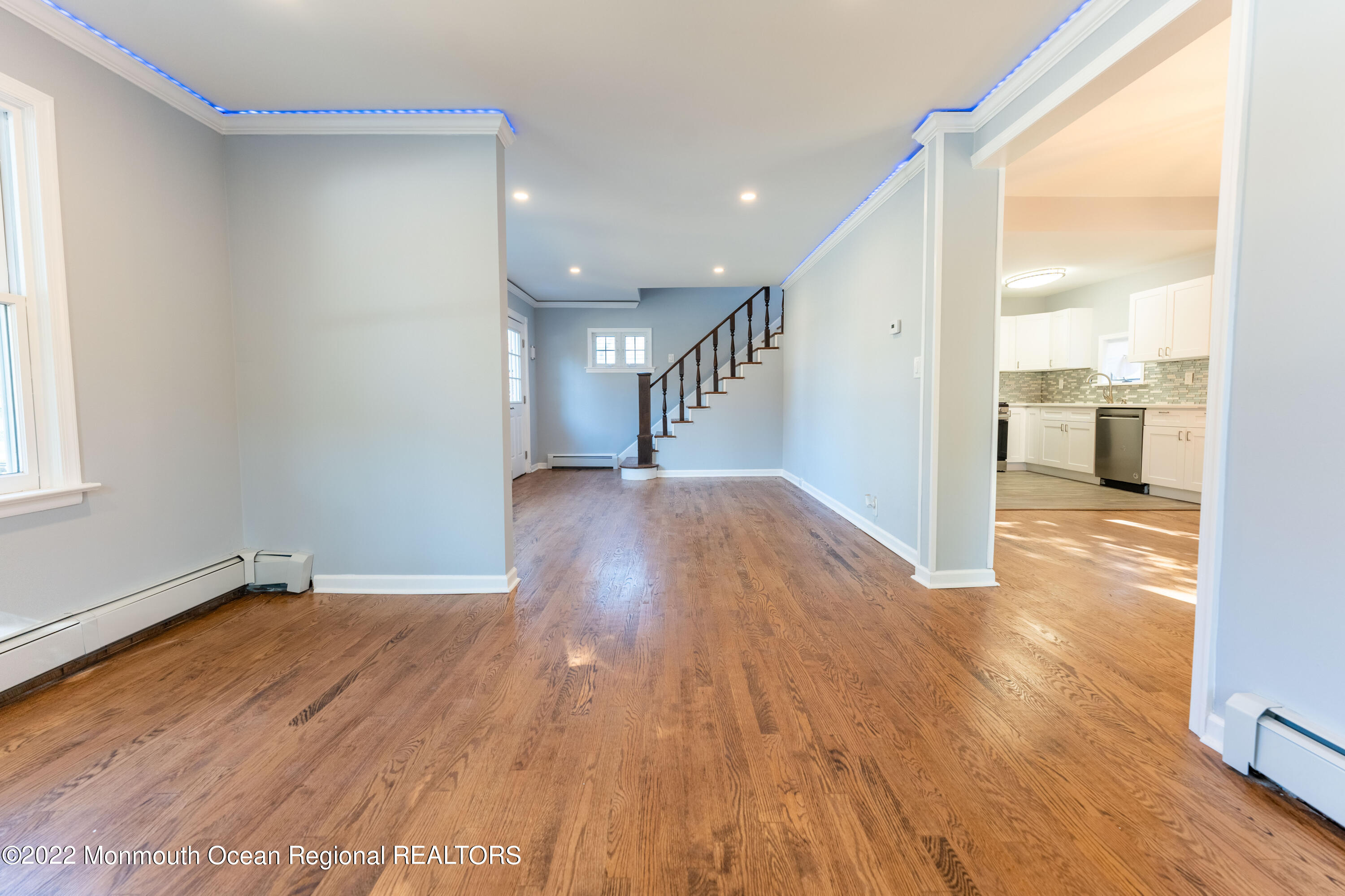 397 E Road Belford, NJ 07718 - Photo 9 of 34 a view of a big room with wooden floor and windows