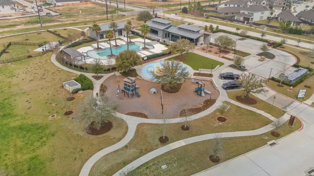 an aerial view of residential houses with city view