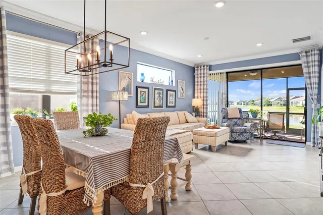 a very nice looking living room with a large window and furniture