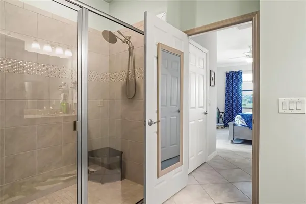 a bathroom with a shower and a sink