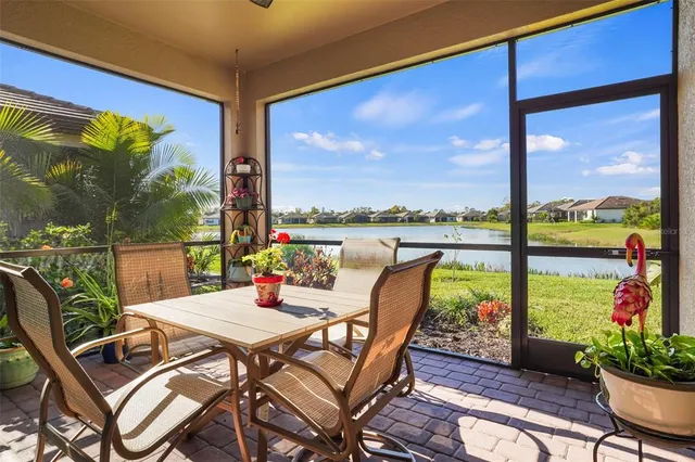 a view of a patio with a table chairs and a table
