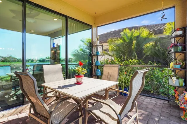 a view of an outdoor dining space with a table and chairs