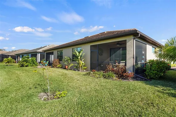 a front view of house with a garden