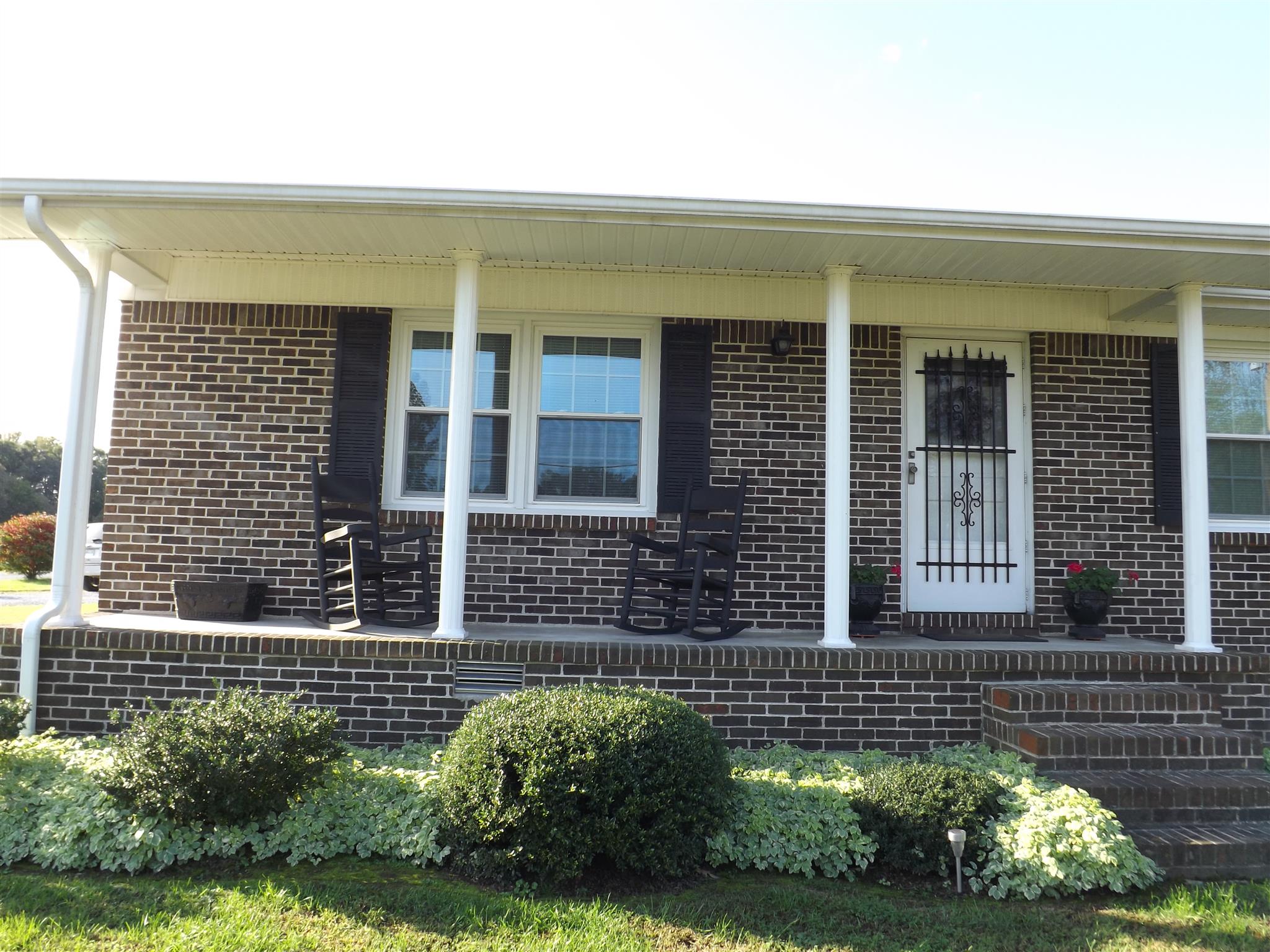 1445 Summitville Road Manchester, TN 37355 - Photo 7 of 22 a view of a brick house with a yard