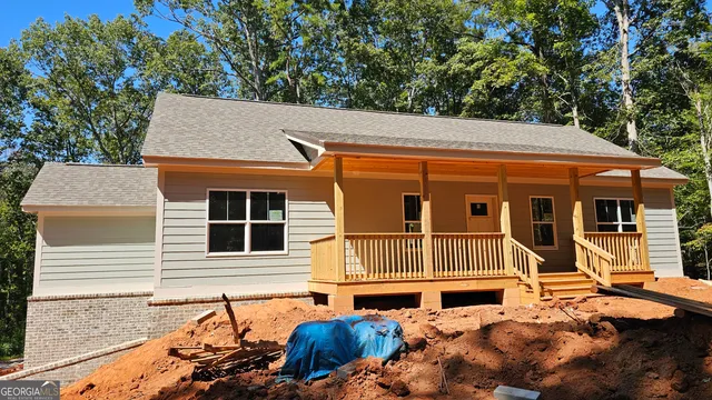 a backyard of a house with seating space