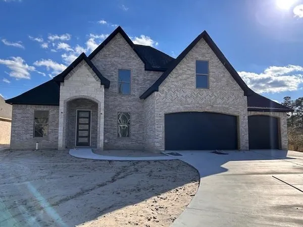 a front view of a house with a garage
