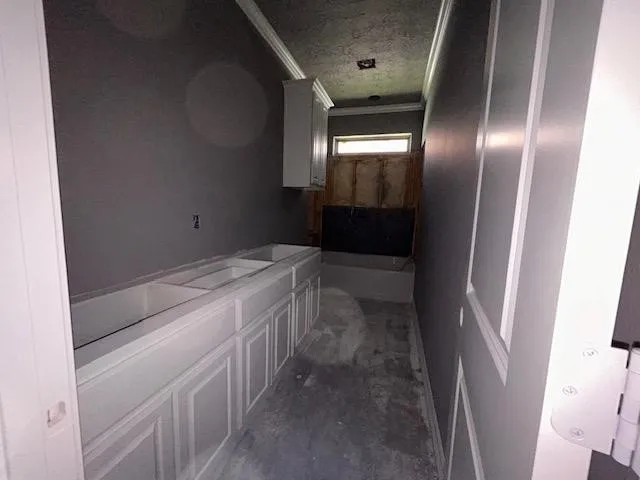 a bathroom with a sink and glass door