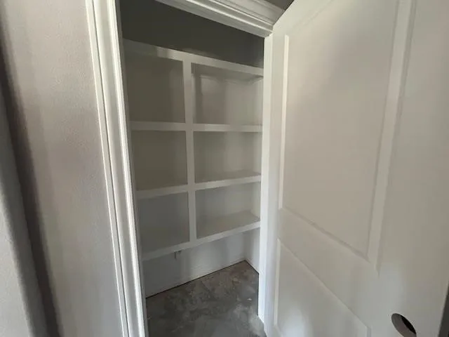 a view of an empty walk in closet