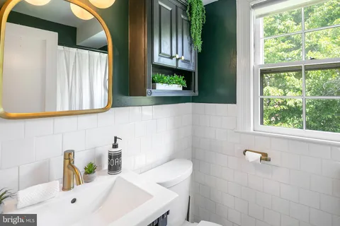 a bathroom with a sink and a window