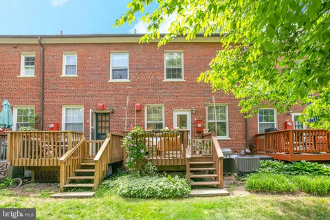a front view of a house with a yard table and chairs