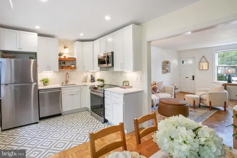 a kitchen with a refrigerator and a sink