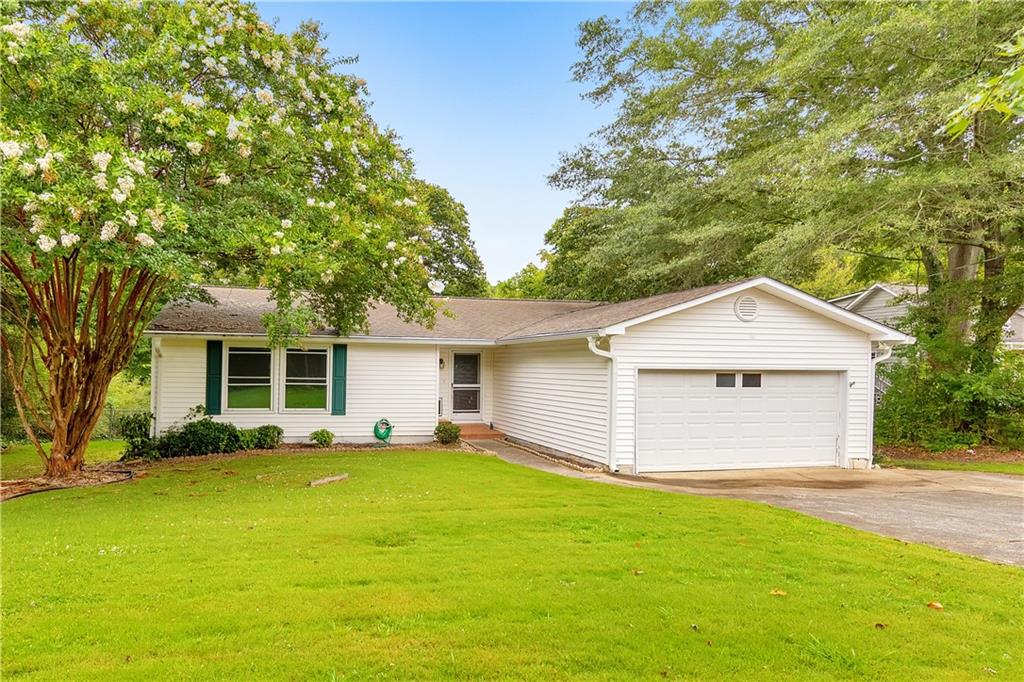 a view of a house with a yard