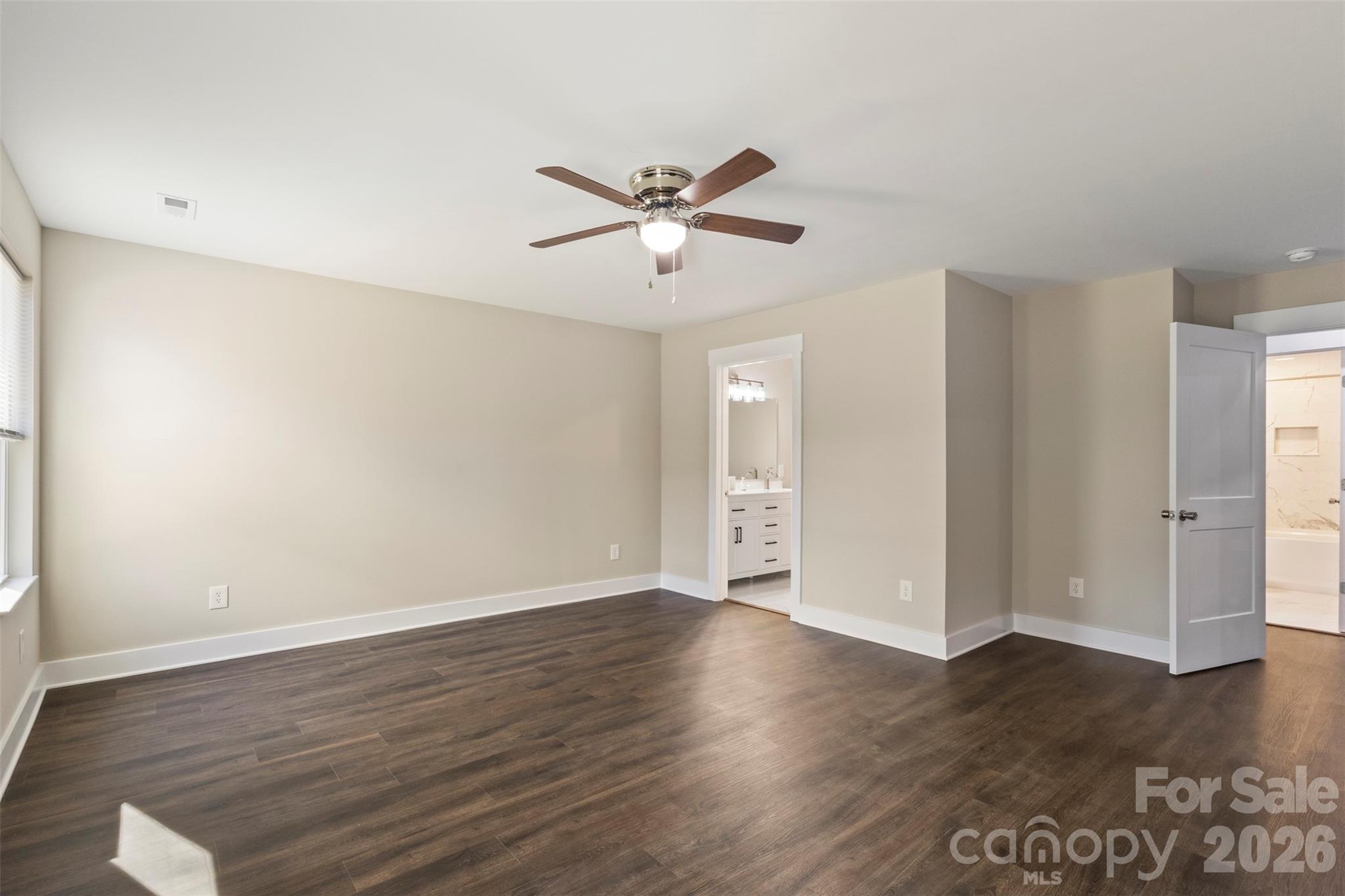 316 Union Street Maiden, NC 28650 - Photo 15 of 21 a view of a room with wooden floor and a ceiling fan