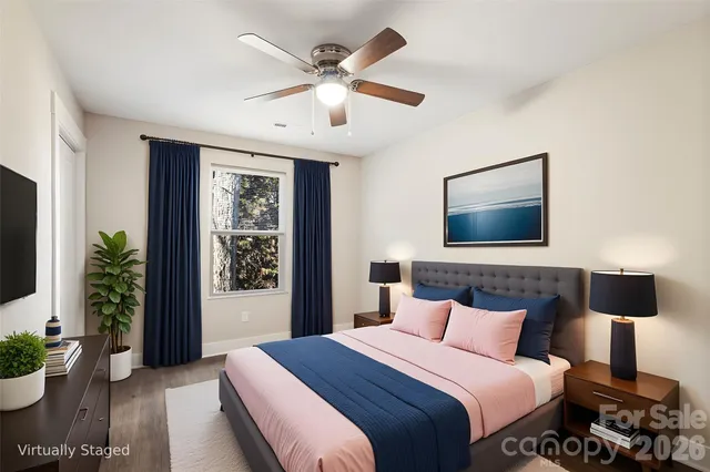 a bedroom with a large bed and a window