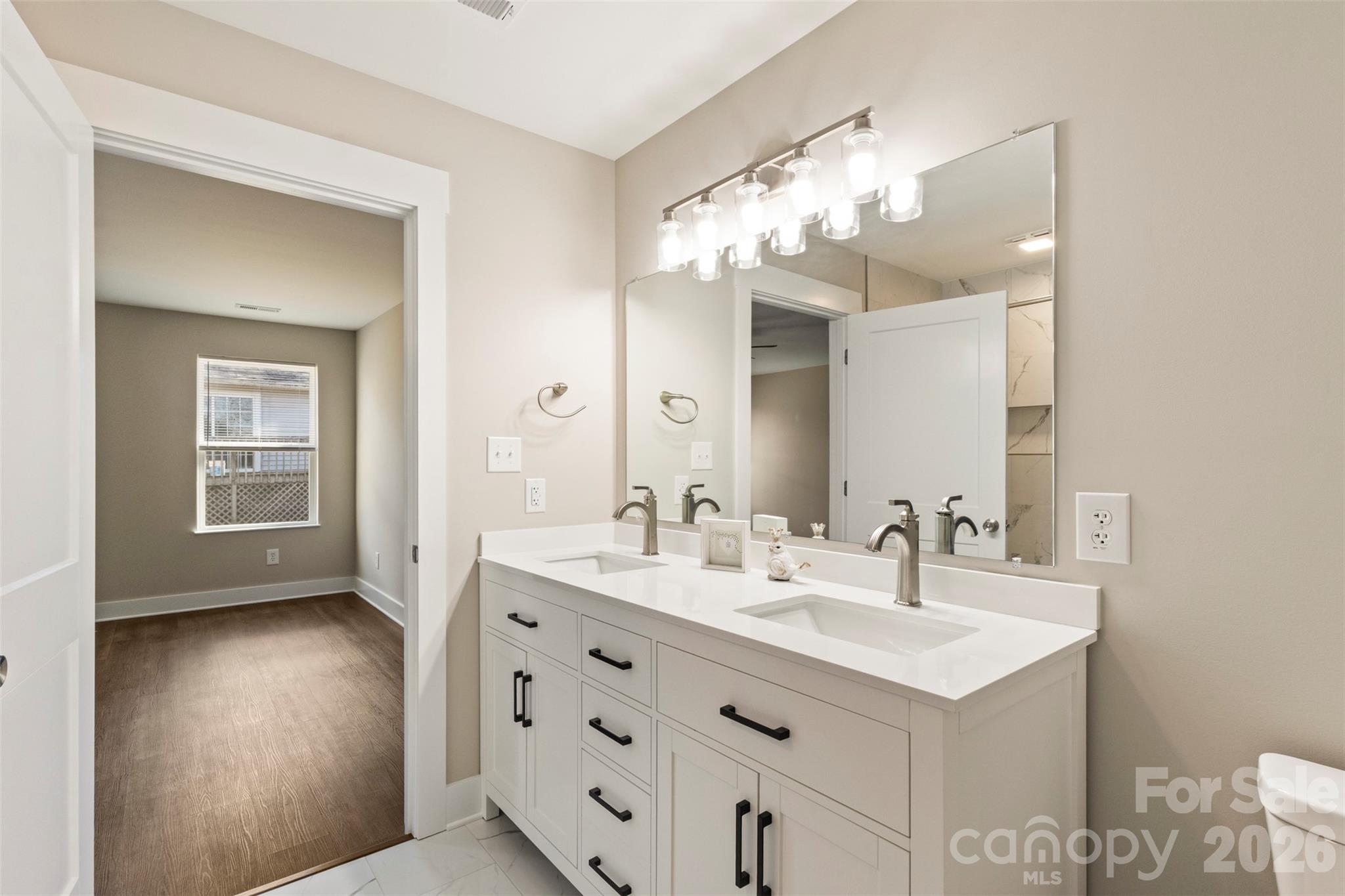 316 Union Street Maiden, NC 28650 - Photo 20 of 21 a bathroom with a sink double vanity and a mirror