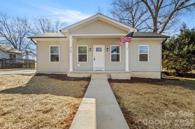 a front view of a house with yard