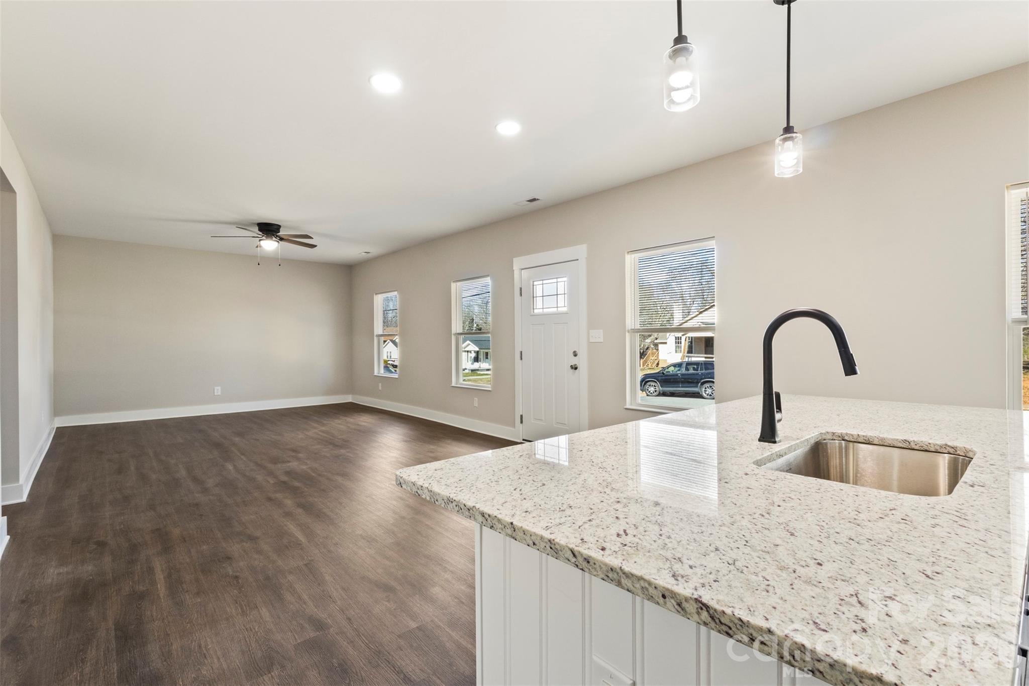 316 Union Street Maiden, NC 28650 - Photo 4 of 21 a kitchen with granite countertop a sink and natural light
